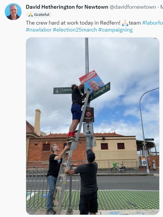 An Twitter post from Newtown Labor candidate David Hetherington showed his team putting up corflutes on an electrical pole. Picture: Twitter.