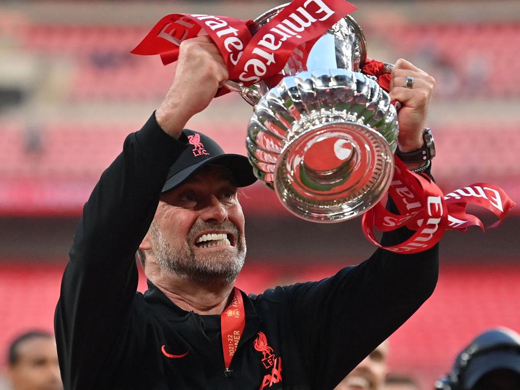 Liverpool manager Jurgen Klopp celebrates with the trophy after winning the FA Cup final. Picture: Glyn Kirk/AFP