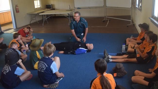 EMERGENCY INSTRUCTION: Officer in Charge of the Biloela Ambulance Service Terry Zillman teaches students vital CPR knowledge at the Biloela PCYC.