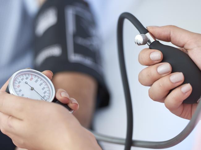 Gold Coast Bulletin - Good Health Guide - May 2018. Nurse measuring blood pressure.