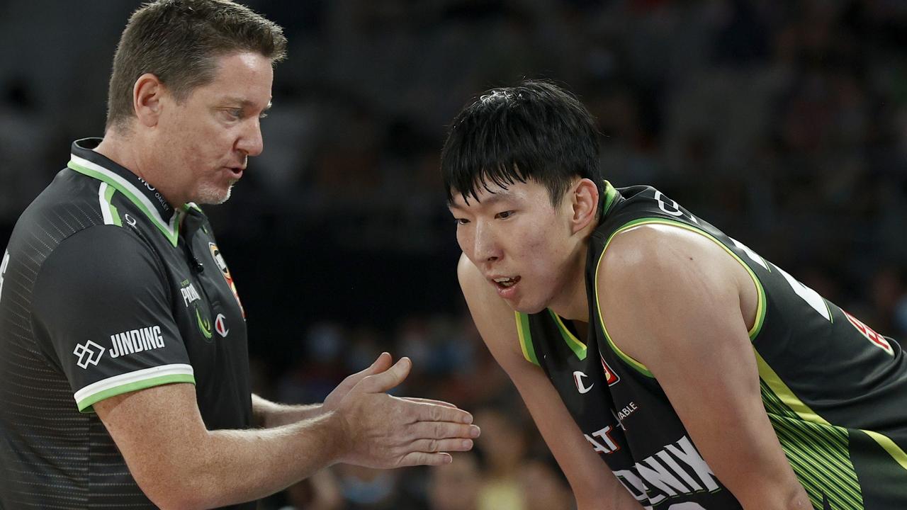 Coach of the South East Melbourne Phoenix, Simon Mitchell speaks to Zhou Qi during the round 11 NBL match between South East Melbourne Phoenix and Tasmania JackJumpers at John Cain Arena. Photo Darrian Traynor/Getty Images.