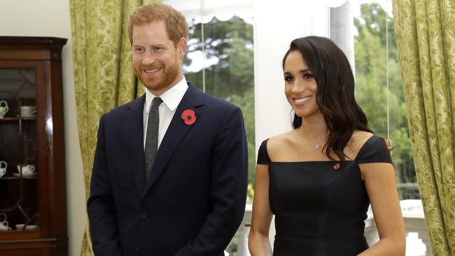 Britain's Prince Harry and Meghan, Duchess of Sussex wait to meet New Zealand Prime Minister Jacinda Ardern. Picture: AP