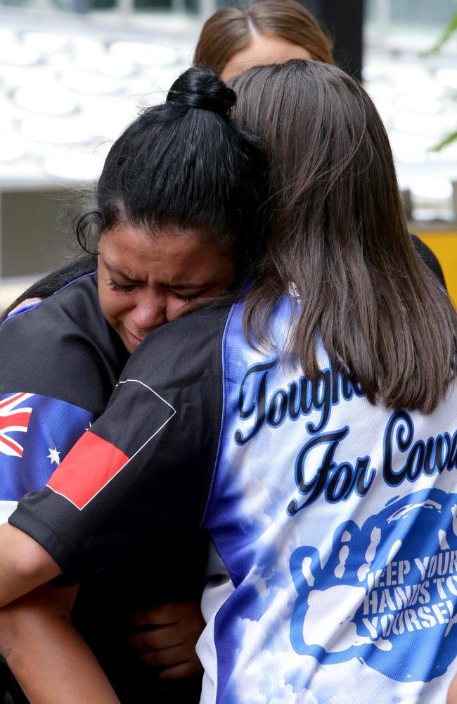 “Tragic case”: The family of one-punch victim Trevor Duroux embrace outside the Supreme Court in Brisbane after Heather was sentenced to six and a half years jail over deadly attack. Picture: AAP/Dan Peled