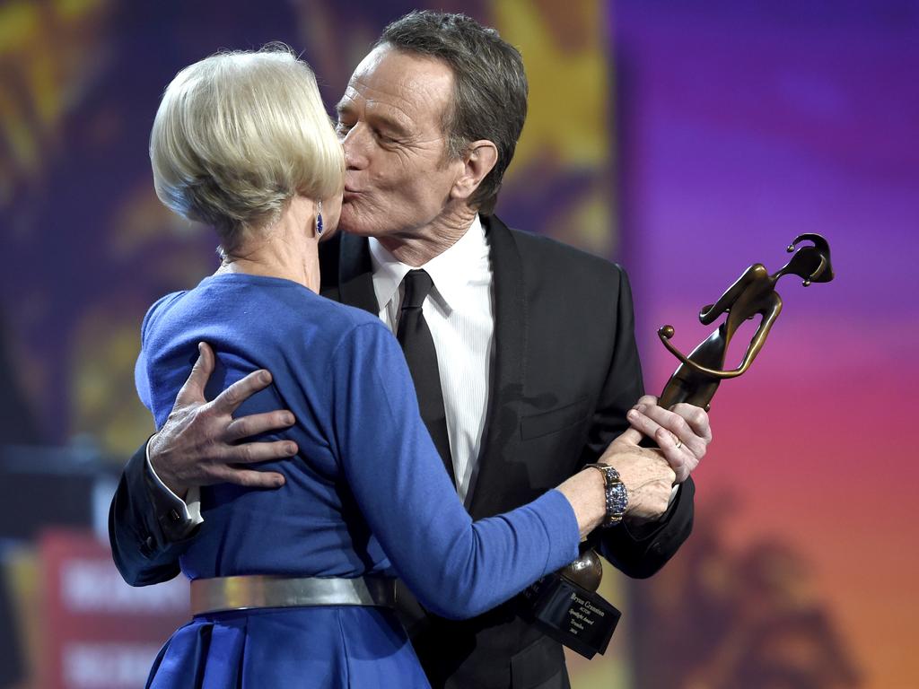 Helen Mirren, left, presents the spotlight award - actor to Bryan Cranston at the 27th annual Palm Springs International Film Festival Awards Gala on Saturday, Jan. 2, 2016, in Palm Springs, Calif. Picture: Chris Pizzello/Invision/AP