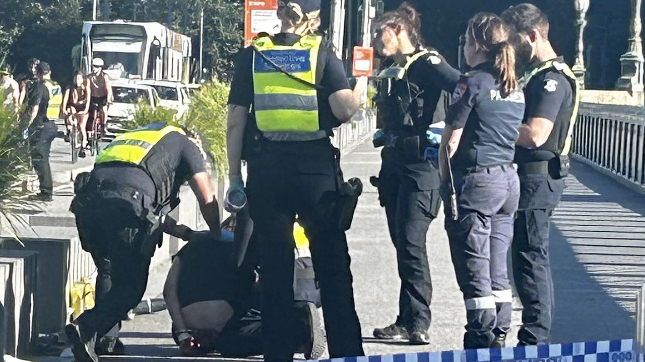 Police arrest the South Melbourne man on Princes Bridge.