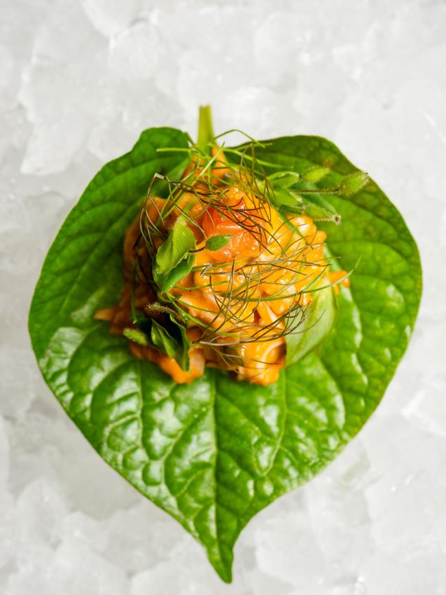 Mud crab, preserved chilli and betel leaf.