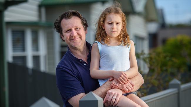 Alex Brucki, 49, and daughter Zoe, 7, live in Kingsville, which went into stage four a week earlier than most of Melbourne. Picture: Jay Town