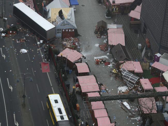 The morning after: the trailer of a truck stands beside Christmas market huts in Berlin, Germany. Picture: AP