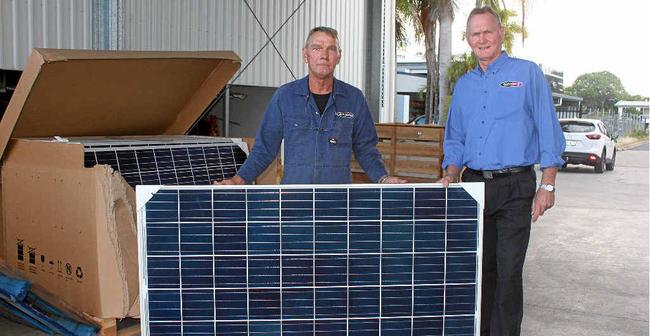 Keith Dobinson and his brother Glen unveil the first of 2000 solar panels to be installed over the coming month to help the business get off the grid. Picture: Amber Hooker