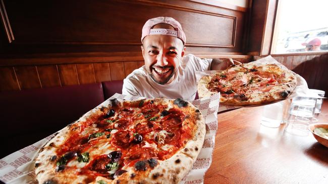 Franc Jrs have opened their second Gold Coast venue at Nobby's Beach .Co owner and chef Carlos Lara with some of their delicious Pizza. Picture Glenn Hampson