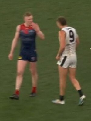 Clayton Oliver alerts Cripps to the blood on his face. Picture: Channel 7