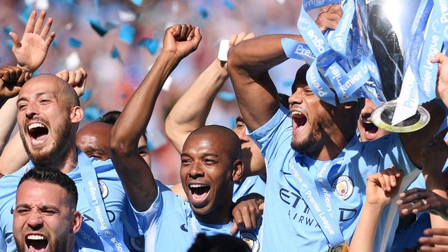 LEICESTER, ENGLAND - MAY 05: Vincent Kompany of Manchester City lifts the Premier League Trophy alongside David Silva, Nicolas Otamendi and Fernandinho as Manchester City celebrate winning the Premier League Title during the Premier League match between Leicester City and West Ham United at The King Power Stadium on May 5, 2018 in Leicester, England.  (Photo by Laurence Griffiths/Getty Images)