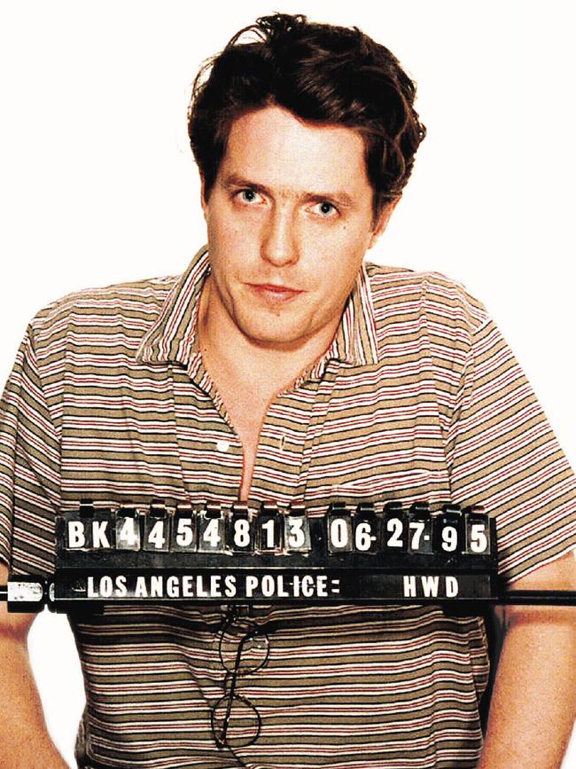 A sheepish <b>Hugh Grant</b> posed for LA police after being arrested for lewd conduct with prostitute Divine Brown on Sunset Boulevard in Hollywood in 1995, a week before his film <i>Nine Months</i> came out. He told TV host Jay Leno that same year: “You know in life what’s a good thing to do and a bad thing to do. I did a bad thing.” Picture: Supplied