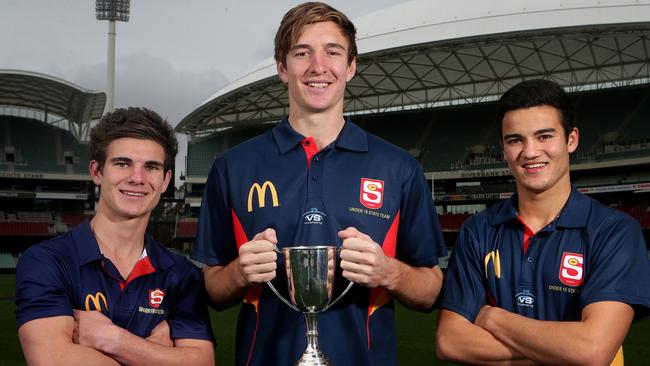 SA U18s players with the U18 National Championship trophy, from left, Jake Johansen, Sam Durdin and Billy Stretch, who is likely to be drafted by Melbourne. Picture: Sarah Reed.