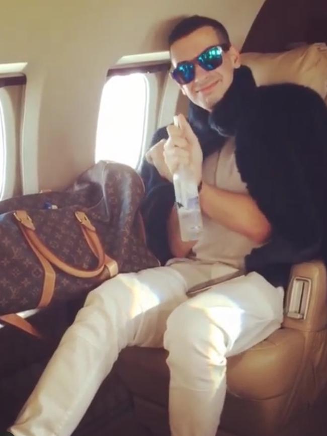 Posing on a private jet.