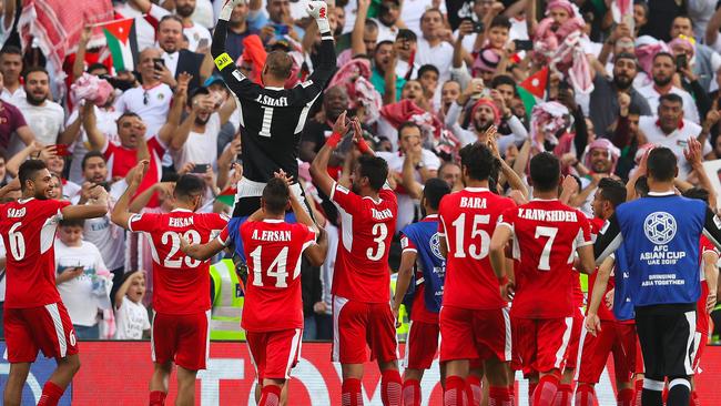 Jordan players celebrate their upset win over Australia in their Asian Cup opener. Picture: Getty Images 