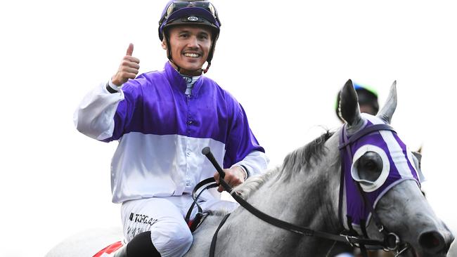 WINNER: Jockey Matthew McGillivray after riding The Candy Man to victory in the Mooloolaba Cup at Corbould Park on Saturday. Picture: AAP Image/Albert Perez.