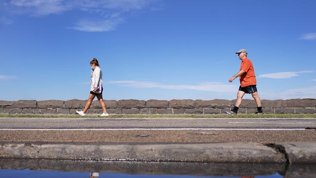 Local residents exercise at South Melbourne beach during stage three lockdown due to the coronavirus. Picture: AAP Image/Michael Dodge