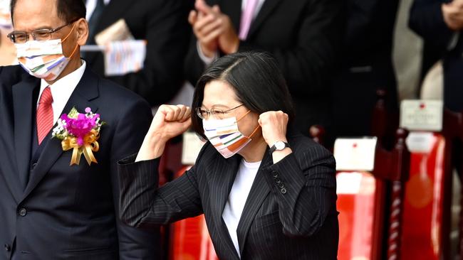 Taiwan President Tsai Ing-wen (C) gestures during the National Day in front of the Presidential Office in Taipei on October 10.