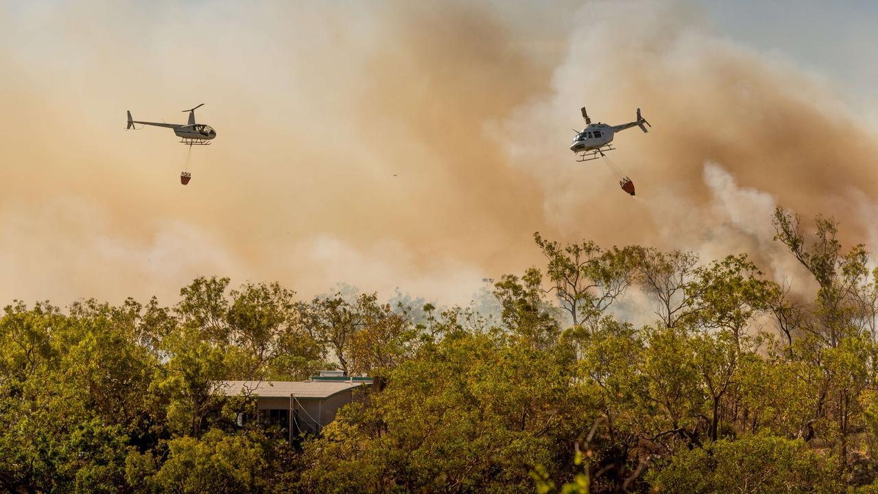 A bushfire threatens homes and properties in the idyllic Lake Bennett region in late August. Multiple helicopters and volunteer firefighting units battled the blaze for two days. Picture: Che Chorley