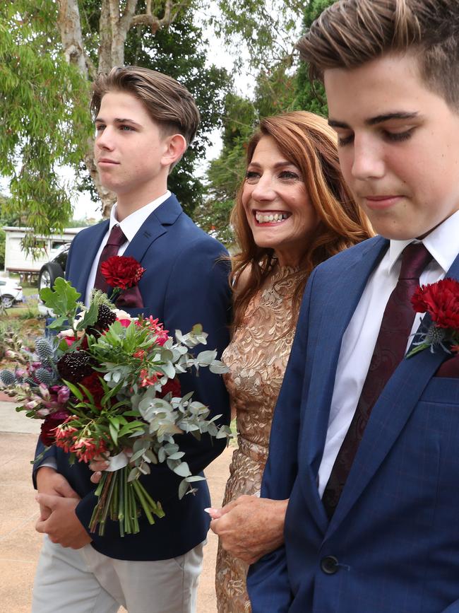 Robin Bailey prepares to be walked down by her sons Fin Smart, 18, and Lewin Smart, 16. Picture: Liam Kidston