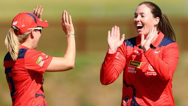 ADELAIDE, AUSTRALIA – OCTOBER 10: Amanda-Jade Wellington of the Scorpions celebrates with Jemma Barsby of the Scorpions taking the wicket of Lilly Mills of WA for a duck – caught Madeline Penna of the Scorpions during the WNCL match between South Australia and Western Australia at Karen Rolton Oval, on October 10, 2023, in Adelaide, Australia. (Photo by Sarah Reed/Getty Images)