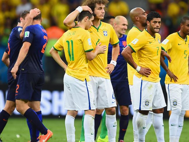 BRASILIA, BRAZIL - JULY 12: David Luiz consoles Oscar of Brazil as Hulk and Fernandinho of Brazil look on after a 3-0 defeat to the Netherlands during the 2014 FIFA World Cup Brazil Third Place Playoff match between Brazil and the Netherlands at Estadio Nacional on July 12, 2014 in Brasilia, Brazil. (Photo by Jamie McDonald/Getty Images)