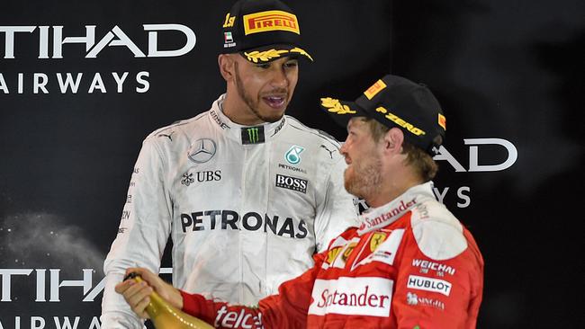Sebastian Vettel (R) with Lewis Hamilton at the Abu Dhabi Grand Prix.