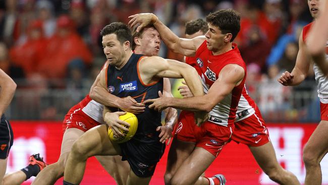 Callum Mills tackle Giants skipper Toby Greene. Picture: Phil Hillyard