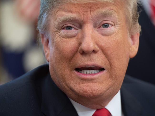 (FILES) In this file photo taken on October 11, 2018 US President Donald Trump speaks prior to signing the Save Our Seas Act, a bill which reauthorizes and amends the Marine Debris Act to promote international action to reduce marine debris, in the Oval Office of the White House in Washington, DC. - President Donald Trump is reported to be preparing a reshuffle at the White House -- fueled by fallings out between his wife and senior staff -- after a week of angry brooding over midterm elections that weakened his grip on Congress. The start to the second half of Trump's first term is enveloped in gloom as the president surveys the damage from the midterms, tension with some of America's closest allies, and now turmoil inside the administration. (Photo by SAUL LOEB / AFP)