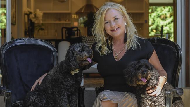 Adelaide homeowner Emma Patten, with her dogs Angel and Bella, is cashing in on the housing boom by selling up and moving to the country. Picture: Roy Van Der Vegt