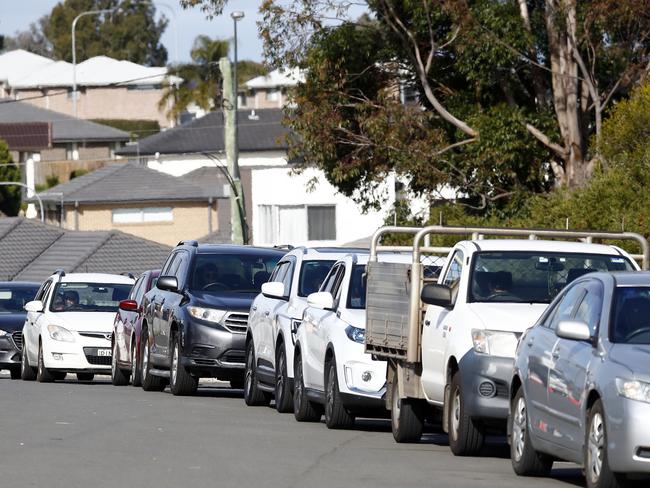 Motorists queue to get COVID-19 tested at a pop-up clinic at Casula’s Crossroads Hotel. Picture: Sam Ruttyn