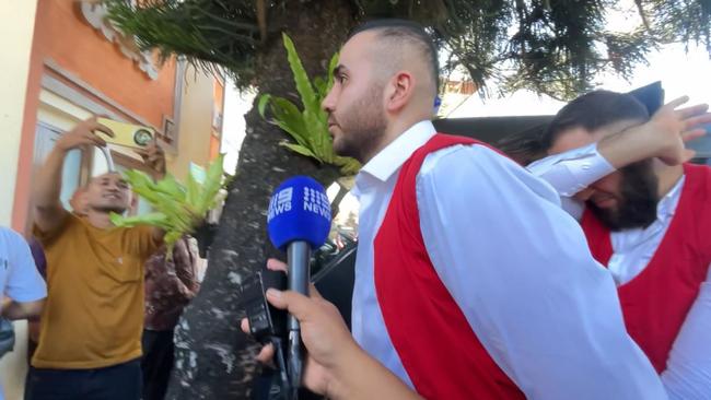 Ali Shahrouk, pictured with hand over face, was handcuffed to fellow Australian Mohamad Rifai (front). Picture: Komang Erviani