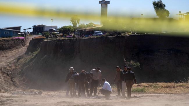 Their bodies were found down a well in El Faro, Santo Tomas. Picture: Guillermo Arias/AFP