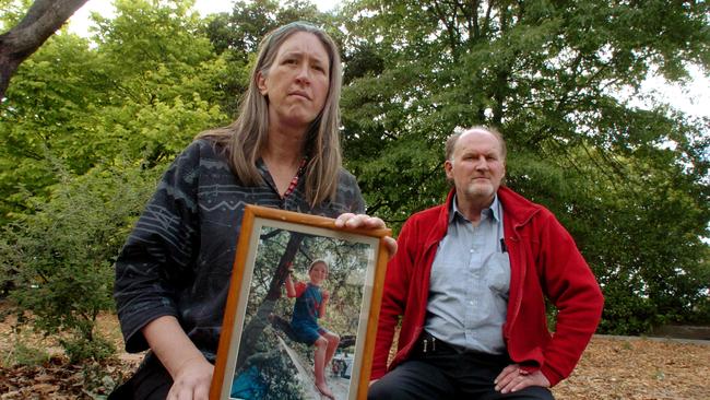 Jasmine Payget and Laurie Strathdee in a memorial garden at Lawson Primary School designed in honour of their son Rian.