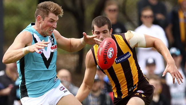 Port Adelaide’s Brett Eddy competes against Hawthorn’s Ben Stratton. Picture Sarah Reed
