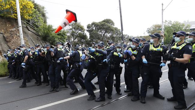 Police face off against the angry mob in Kew. Picture: Alex Coppel