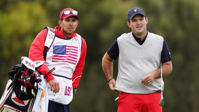 Patrick Reed (right) with caddie Kessler Karain. Picture: AAP