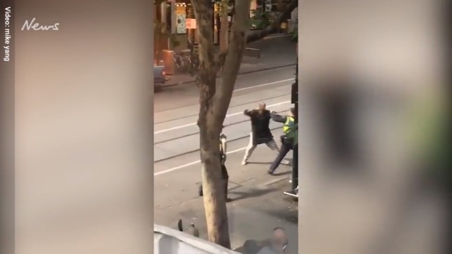 Man attacks officers with knife on Bourke St