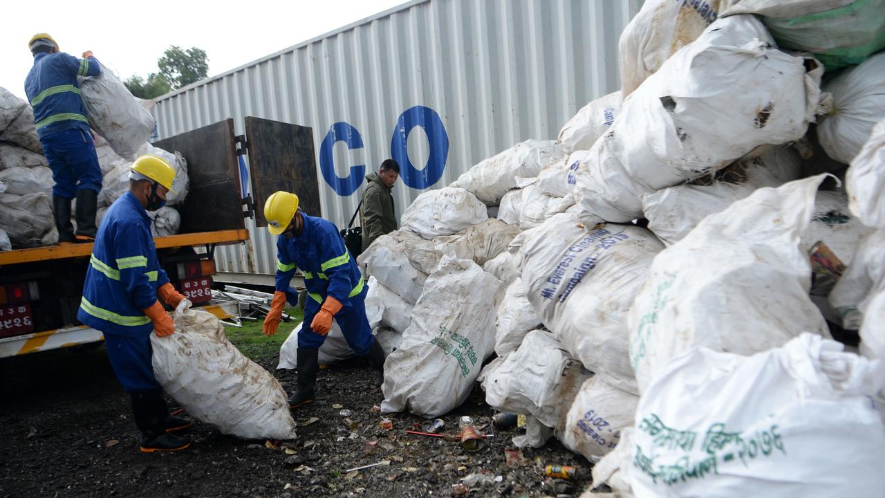 During a recent clean-up, another four bodies — along with 11 tonnes of rubbish — were found on the mountain. Picture: PRAKASH MATHEMA / AFP.