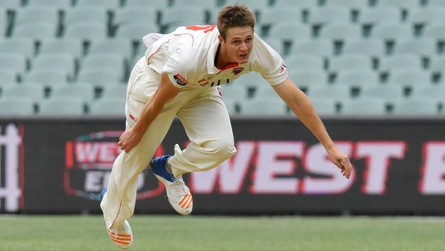 Joe Mennie at full flight during his lethal spell for the Redbacks. Picture: AAP Image/David Mariuz