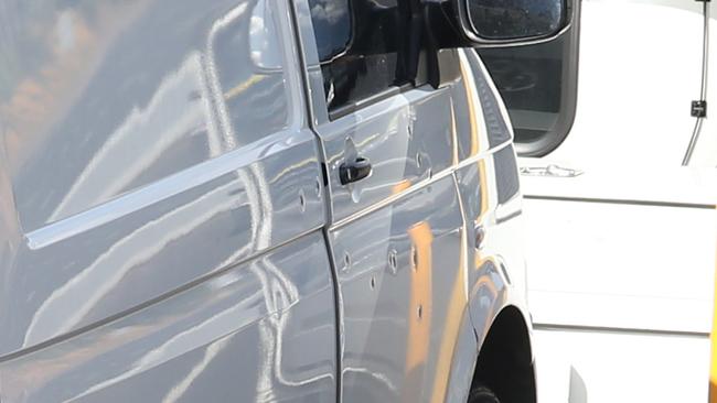 Bullet holes in the driver’s side door of Mr Virgona’s van. Picture: David Crosling