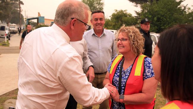 PM Scott Morrison arrives with non-perishable items on his visit to the donations centre in Lucknow on the outskirts of Bairnsdale. Picture: Aaron Francis/The Australian