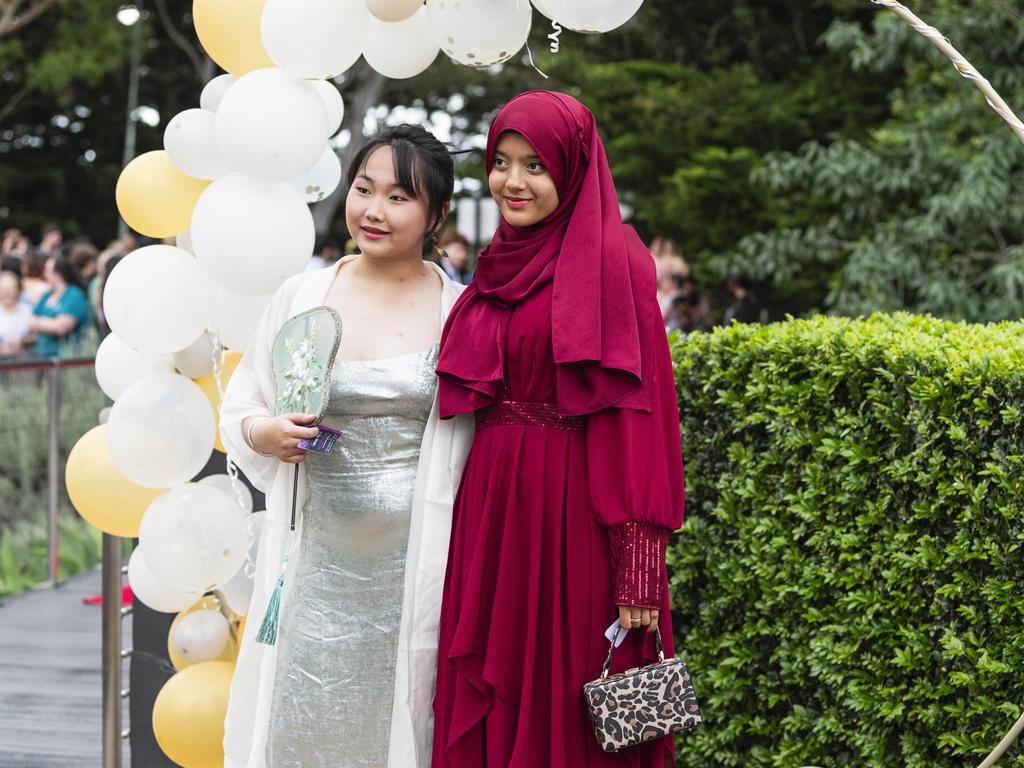 Wenquig Jiang (left) and Duti Raisa at Centenary Heights State High School formal at Picnic Point, Friday, November 15, 2024. Picture: Kevin Farmer