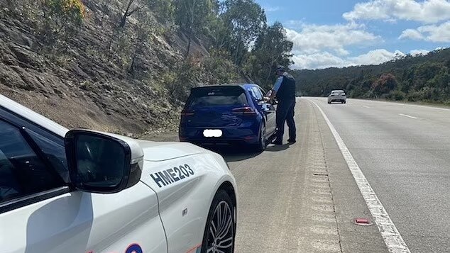 NSW Police supplied picture showing police pulling over Rajabali Atoev after he was caught doing 280km in a Volkswagen on the Hume Hwy outside Mittagong. Picture: Supplied