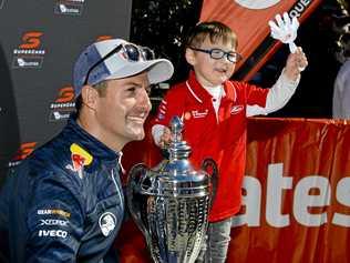 Defending Supercars champion Jamie Whincup meets four-year-old Oliver Emerson-Fay at the Coates Hire Ipswich SuperSprint Community Day. Picture: Cordell Richardson