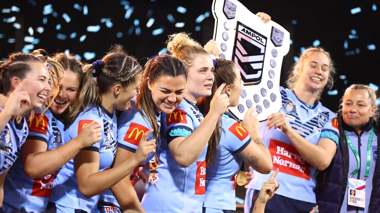 The Blues celebrate after reclaiming the State of Origin shield. (Photo by Mark Nolan/Getty Images)