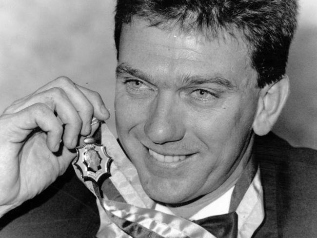 South Adelaide footballer Mark Naley with his 1991 Magarey Medal. Picture: Neon Martin