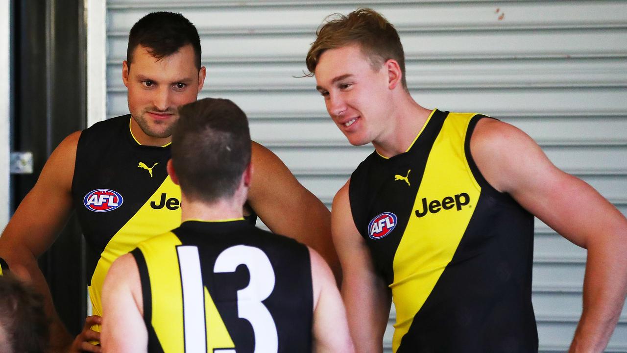 Jack Higgins (no.13) keeps teammates Toby Nankervis and Tom Lynch entertained on team photo day. Pic: Getty Images