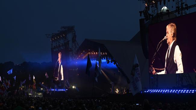 Paul McCartney looms large over the Glastonbury crowd. Picture: Leon Neal/Getty Images